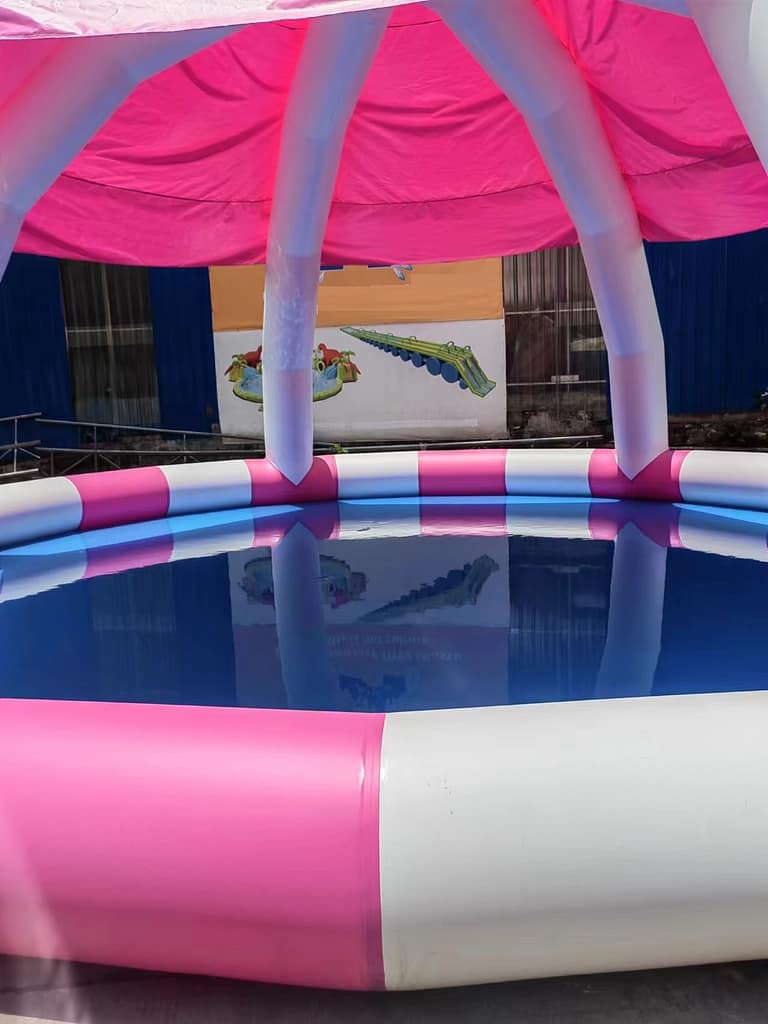 Inflatable mushroom pool with umbrella on top, pink, close-up